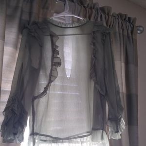 A green ruffled blouse